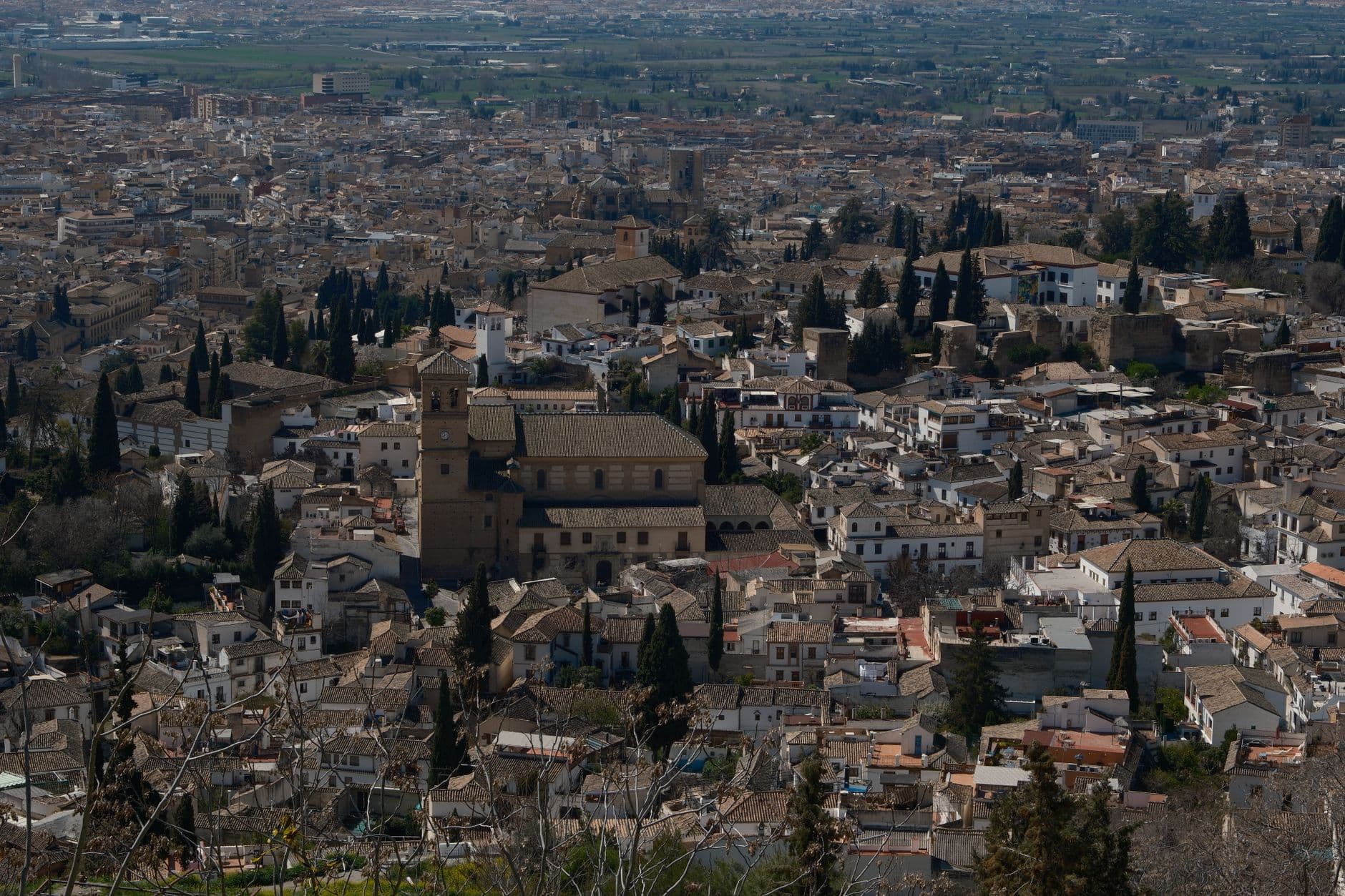 Aerial view of Granada's historic cityscape with iconic Alhambra architecture.