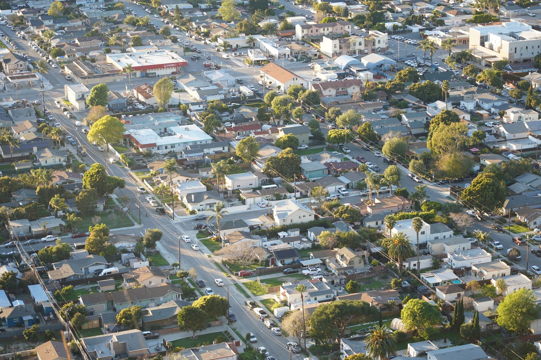 Overhead shot of a suburban neighborhood in Ventura, showcasing homes and streets.