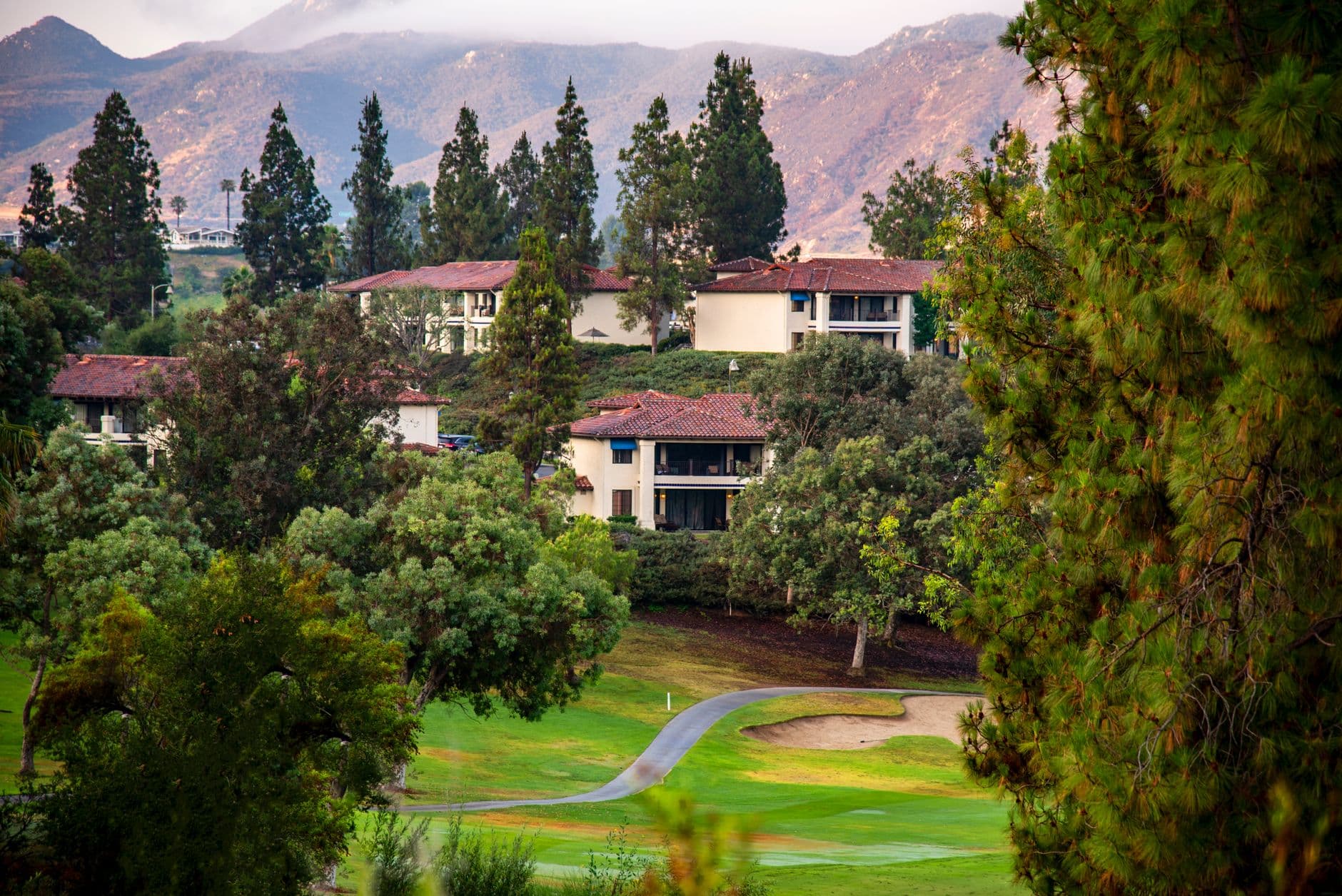 Charming villas surrounded by lush greenery & mountains in Escondido, California.