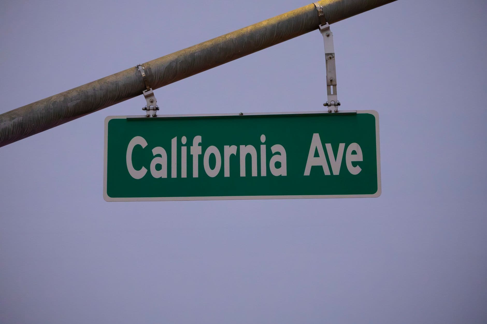 Image of California Avenue street sign against a twilight sky.